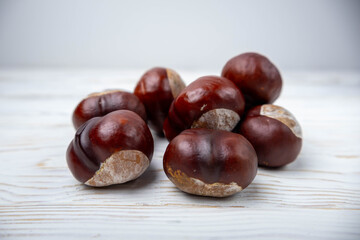 Group of chestnuts without their shells on a white background