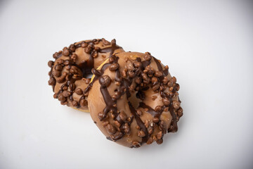 Glazed bagel with cappuccino flavor isolated on a white background. Chocolate donut.