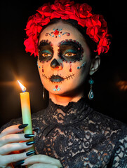 Halloween beauty close-up portrait of woman. Beautiful female face adorned with Santa Muerte makeup.