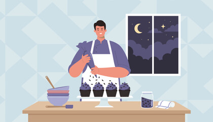 Smiling man decorating festive Halloween cupcakes with purple frosting and bat sprinkles at night