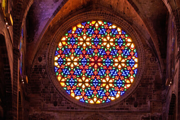 Colourful glass in the Rose window inside the Palma cathedral