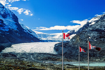 Canadian flags by the Columbia icefield in the Canadian rockies