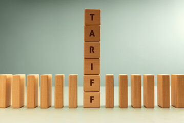 Dominoes row with vertical stack labeled TARIFF, Trade barriers affect global economies in domino impact