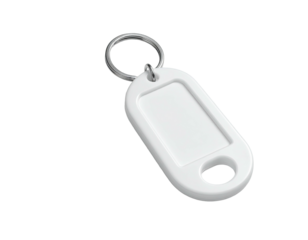 Close-up of a white key tag with a silver keyring against a black background
