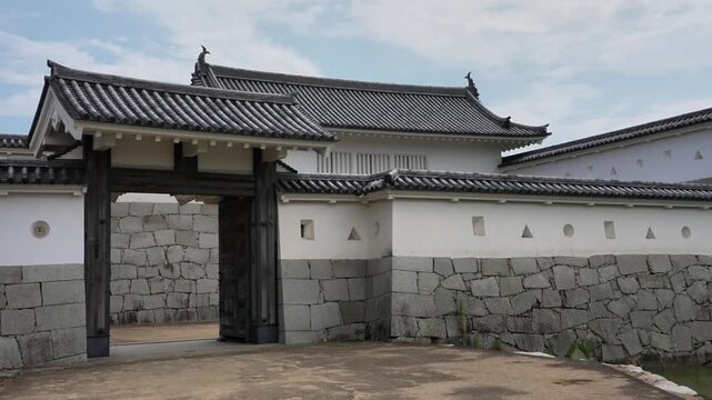 Ako Castle (Japan's Top 100 Castles): Main gate and turret form a defensive trap; pavilion-style structures on stone walls with shooting holes, antique yet exquisite.