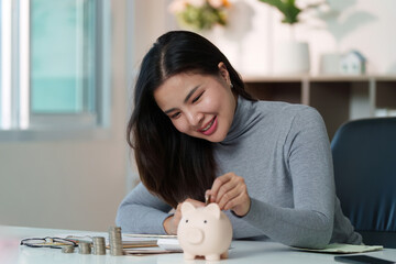 Financial Empowerment: Young Woman Saving Money with Piggy Bank