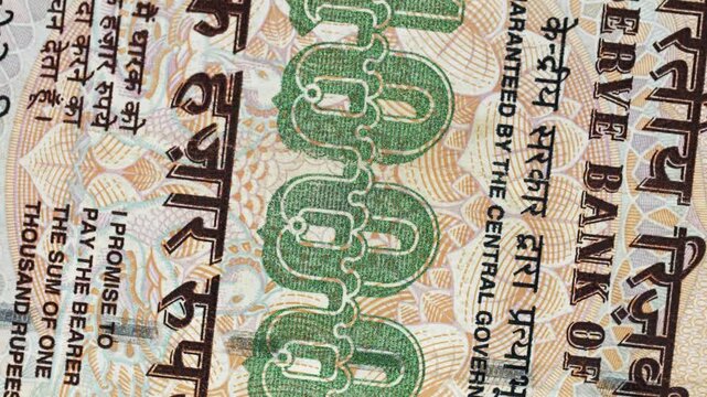 India 1000 rupees banknote obverse with denomination numeral rotating on black background
