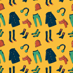Set of warm clothing in doodle style, seamless pattern, hand-drawn illustration. Playful elements, Bright palette, joyful yellow background. Perfect for cozy autumn and winter seasonal projects.