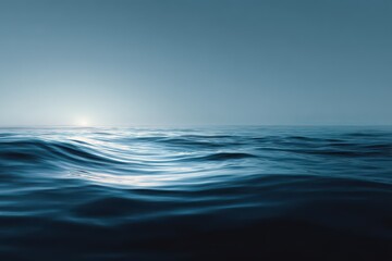 Obraz premium Serene Ocean Horizon - Calm Blue Waves Reflecting Sunlight, Peaceful Seascape.