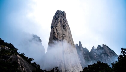 Towering Granite Peak Emerging from Mist in Huangshan Mountains.