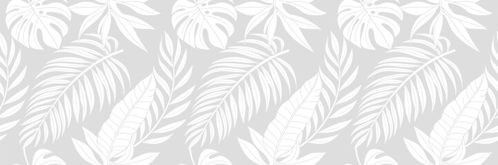 Soft tropical leaf seamless pattern in light gray tones featuring palm and monstera foliage, perfect for elegant wallpaper, fabric, background, and minimalist botanical surface design. © IT park