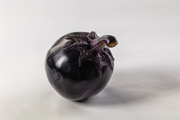 Raw round black big eggplant