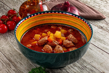 Tomato soup with meatballs and vegetables