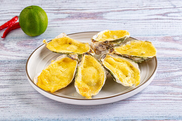 Baked oyster with parmesan cheese