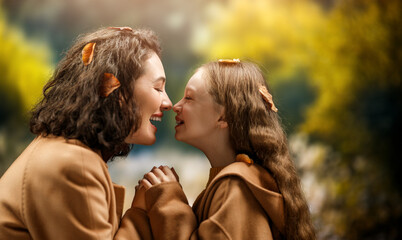 Fototapeta premium Mother and child daughter on autumn walk