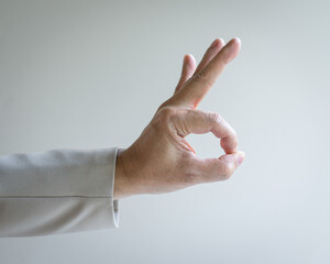 Businessman making ok sign. Close up view.