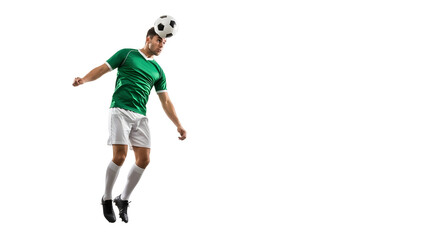 Soccer player in green jersey heading the ball during a match.