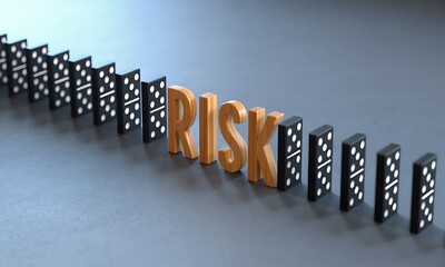 Wooden letters spelling RISK blocking falling dominoes, symbolizing prevention and strategy in risk management for business and decision-making concepts
