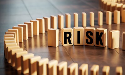 Wooden domino blocks in circular pattern with 'RISK' text, ideal for illustrating business strategy, decision making, and chain reaction concepts