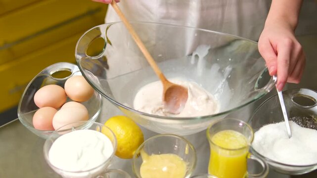Cook Mixes Flour With Eggs For Pancake. Preparing Breakfast In Home Kitchen. Kneading Dough With Whisk For Baking Cake. Chef Cook Dessert Mixing Dough. Pancake Culinary. Whisk Mixing Dough.