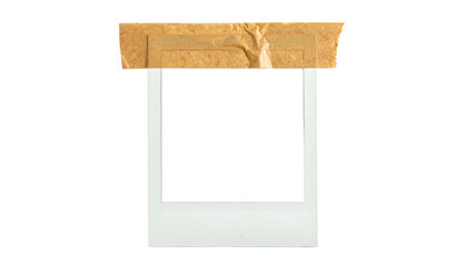 Empty instant film photo frame held in place with brown tape, black background