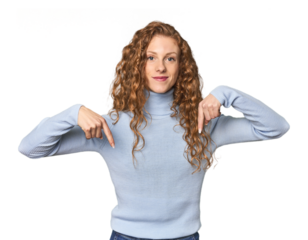 Simple redhead studio portrait pointing temple with finger, thinking, focused on a task.