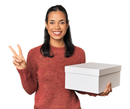 Young Filipina holding a box showing number two with fingers.