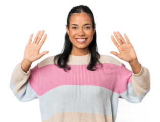 Young Filipina woman showing number ten with hands.