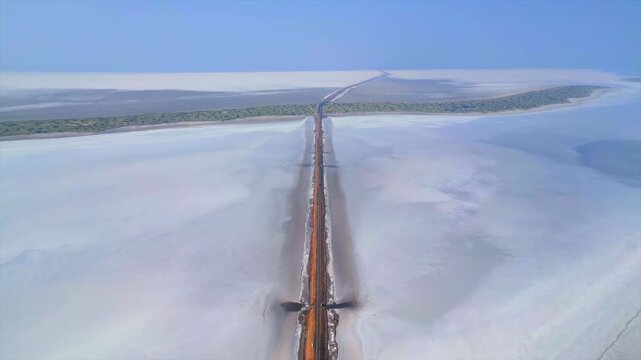 Aerial view of the Road to Heaven, Dholavira, stretching across the White Rann of Kutch, India, Stunning desert landscape with endless salt flats and a serene sky,  Road to heaven, Rann of Kutch