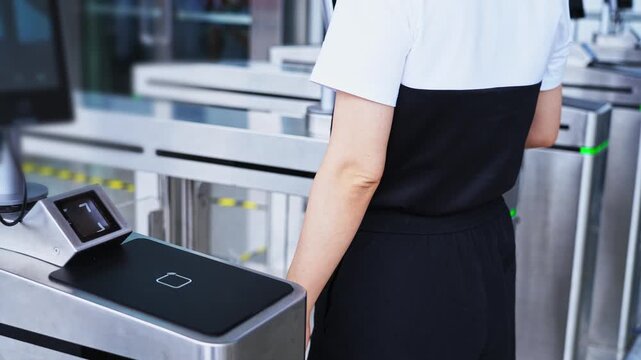 Woman holding mobile phone scanning enters checkpoint, slow motion video