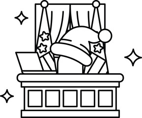 A man in a Santa hat sits at a desk with a laptop