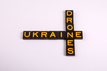 UKRAIUNE and DRONES Concept. Yellow letters on a light background. Symbolizing technology, innovation, defense and modern aerial systems