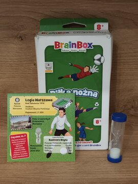 BrainBox football themed educational game with packaging, question card, and plastic sand timer on wooden surface
