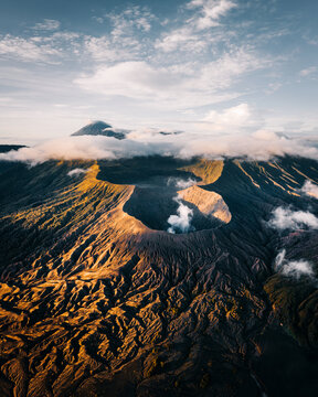Aerial view of the dramatic Bromo Tengger Semeru National Park, where the volcanic crater contrasts sharply with the surrounding landscape, Mt. Bromo, East Java, Indonesia.