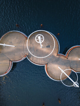 Aerial view of the unique pedestrian bridge, the Inner Harbour Bridge, also known as the Kissing Bridge, with its circular platforms over the dark waters, Copenhagen, Denmark.