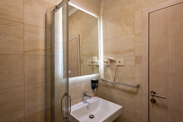 Bathroom interior with glass shower cabin