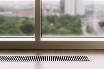 Fototapeta na wymiar Underfloor heating system in a modern living room with a view