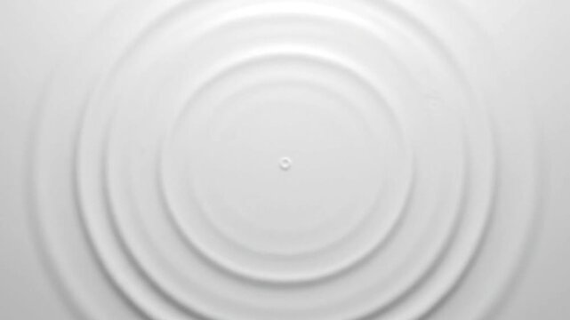 Abstract white circular ripples emanating from a central point, creating a serene and minimalist background