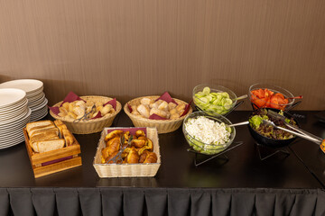 Variety of salads and pastries served at breakfast buffet