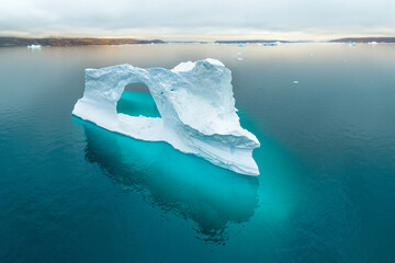 defaultHuge icebergs floating in the sea in a fjord off the coast of Greenland. Floating icebergs,...