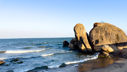 Stacked Coastal Rock Formations with Gentle Ocean Waves