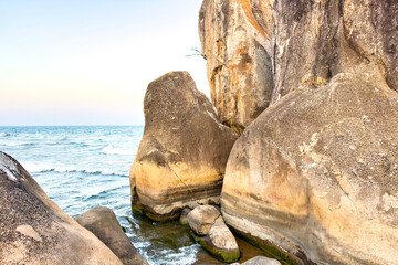 Large beige sandstone rock formations on the shore of Lake Malawi © Clemency