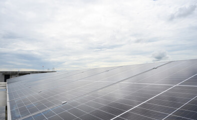 Photovoltaic solar panels are installed on rooftop of building. Regenerative energy system electricity generation, clean energy.