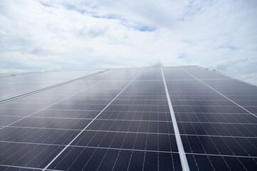 Photovoltaic solar panels are installed on rooftop of building. Regenerative energy system electricity generation, clean energy.