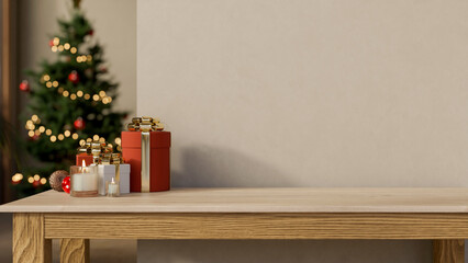 Gift box presents and lighting candles on wooden table aside wall and Christmas tree in room corner