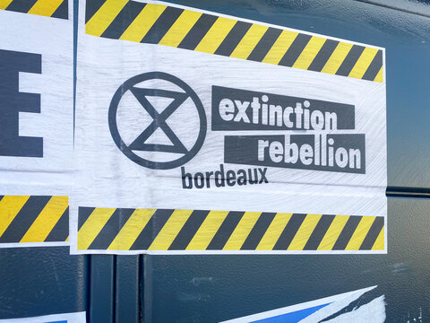 Extinction Rebellion sticker on an out of order Amazon locker vandalized by French anti-capitalism activists in Bordeaux, France