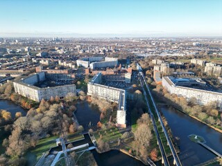 Aerial view of the iconic hexagonal apartment blocks reflected in the tranquil waterways, with the elevated train line cutting through the landscape, Bijlmermeer, North Holland, Netherlands.