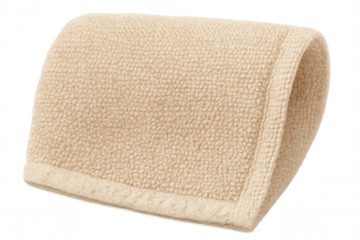 Beige loop terry cloth mat folded for comfort, softness, and absorbency on a transparent background, representing hygiene