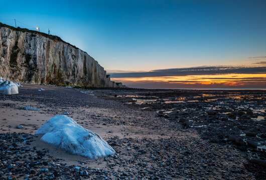 The pebble beach and the cliffs of Ault at sunset, alabaster coast, department of Seine Maritime, Normandy region, France.