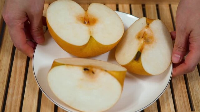 Sliced pear on a plate. Asian pears, nashi pear, organic fruit